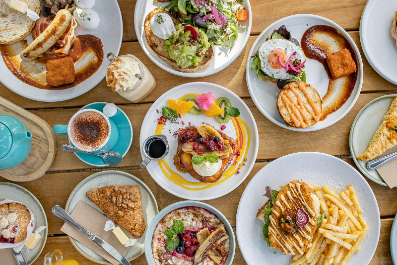 a spread of different brunch foods, featured image for the article 'Discover The Best Brunch Spots on the Golden Mile'